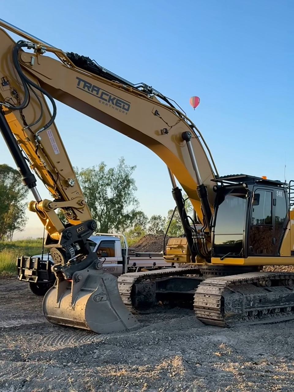 Excavator on site at dusk